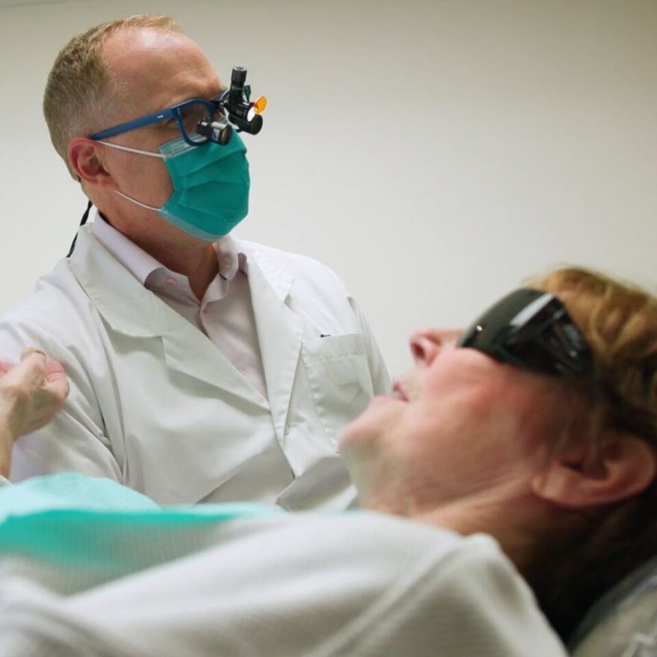 dr theron baker top seattle dentist with patient